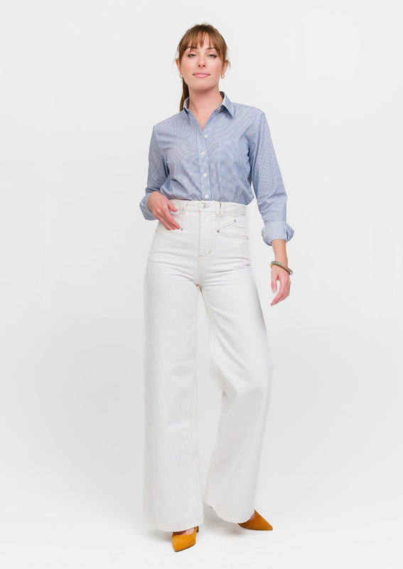 Full length view of woman wearing an Italian cotton luxury button-down shirt with blue polkadots
