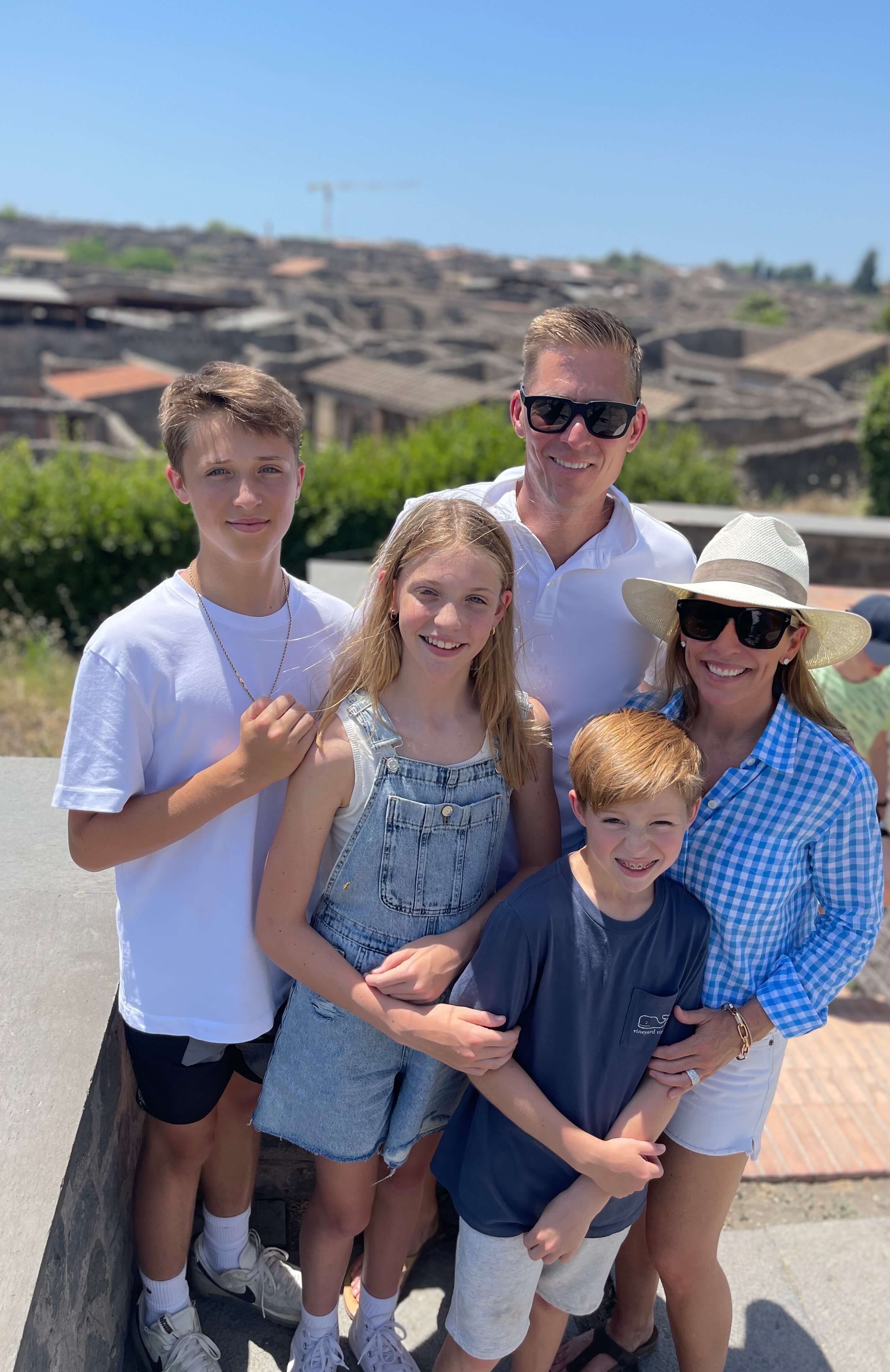 Woman wearing a designer top for trip to Europe with family