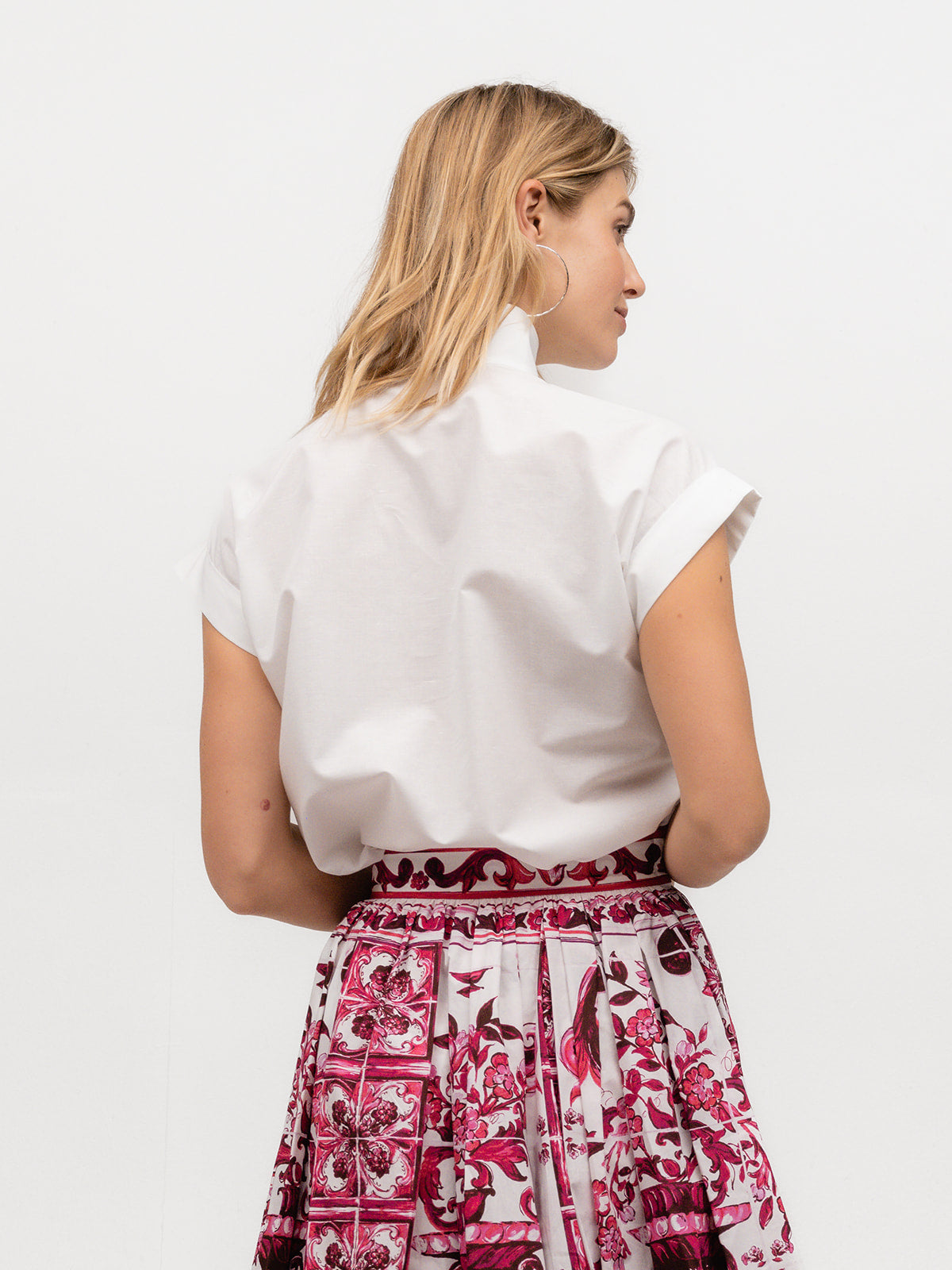 Back of a woman wearing an upscale linen short sleeve top