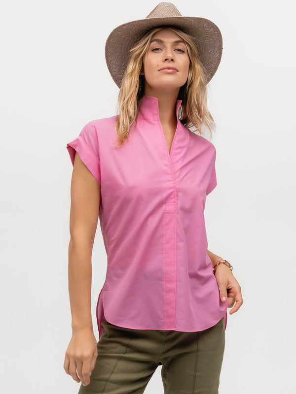 Woman modeling a hot pink designer short sleeve shirt