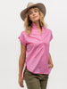Pretty woman modeling a hot pink short sleeve top