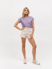 Lady modeling a purple short sleeve luxury top