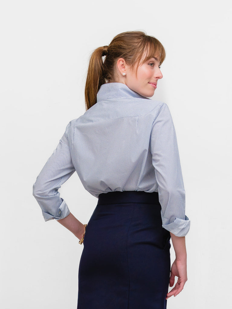 Back of woman wearing blue mini polkadot broadcloth blouse made of Italian cotton