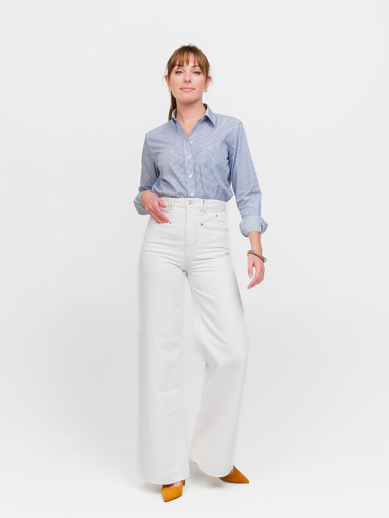 Full length view of woman wearing an Italian cotton luxury button-down shirt with blue polkadots
